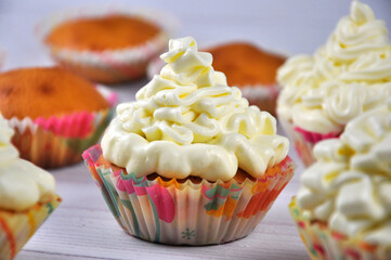Cupcake with white cream, close up.
