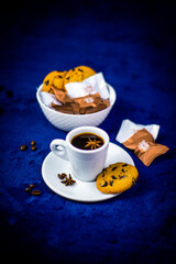 Delicious and healthy spicy tea with honey, cinnamon, anis and citrus. Tasty sweets and cake