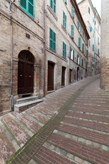 Fototapeta na wymiar Houses on Street of Medieval Town in Italy