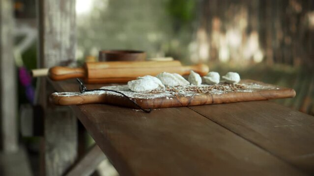 Russian fresh handmade dumplings lying on the wooden table on the cutting board