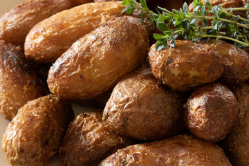 close up of baked potatoes with herbs
