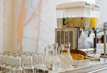 Different types of dishes in containers on the buffet table in the hotel restaurant