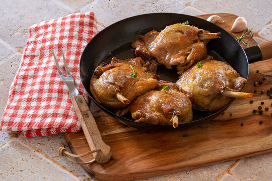 duck confit cooked in a dish