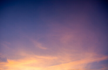 Fototapeta premium Clouds in the sky lit by the setting sun.
