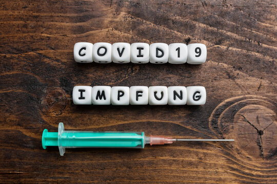 Corona virus Covid-19 vaccine text background in German