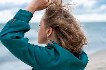 
Portrait of a woman near the sea from the side close-up
- 498509100