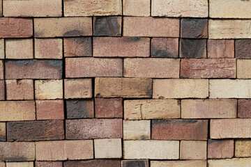 Obraz premium burnt red brick stacked on top of each other for storage