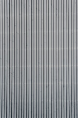 Architectural detail of grey corrugated steel facade