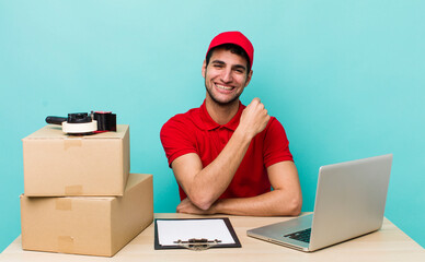 hispanic handsome man feeling happy and facing a challenge or celebrating. packer employee concept