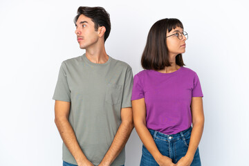 Naklejka premium Young couple isolated on isolated white background nervous and scared
