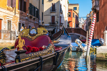 View of empty gondola on narrow canals of Venice, Italy