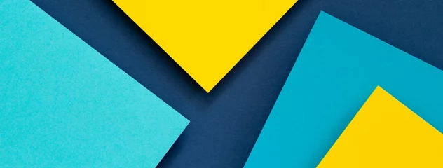 Fotobehang Abstract color papers geometry flat lay composition banner background with blue and yellow tones © vejaa