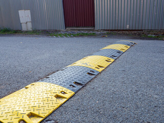 Speed bump on the road to slow down fast moving cars