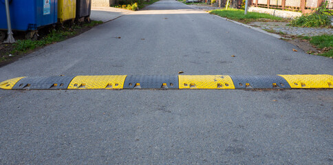 Speed bump on the road to slow down fast moving cars