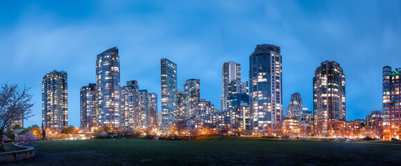 Fototapeta na wymiar Modern Cityscape at Night. Downtown City Building Skyline. Vancouver, British Columbia, Canada. Urban Panoramic Background