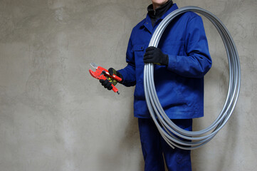 Plumber installing plastic pipes