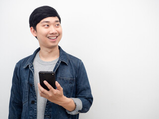 Asian man jeans suit smiling holding mobile phone looking at copy space portrait