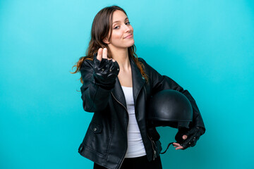 Fototapeta na wymiar Young caucasian woman with a motorcycle helmet isolated on blue background making money gesture