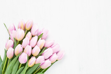 Bunch of pink tulips flowers. Mothers Day, Valentines Day, birthday concept. Top view, copy space