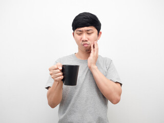 Man grey shirt looking coffee cup gesture toothache unhealth concept