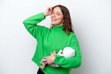 Young caucasian woman with her cute baby isolated on white background having doubts and with confuse face expression