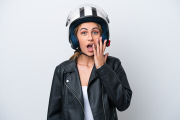 Young caucasian woman with a motorcycle helmet isolated on white background with surprise and shocked facial expression
