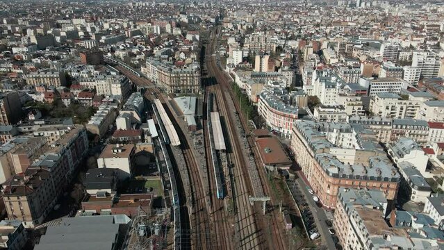 Aerial shot of train station in Parisian suburb - drone