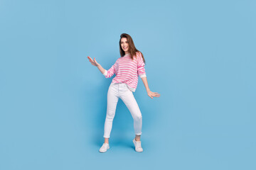 Fototapeta premium Full body photo of excited satisfied lady partying dancing spend free time isolated on blue color background