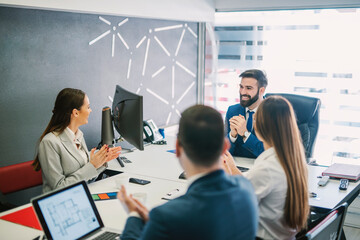Fototapeta premium A small group of businesspeople having meeting at boardroom.