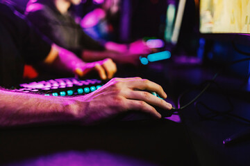 Fototapeta premium Close up of gamer's hand using a computer mouse.