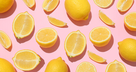 Many ripe lemons on pink background, top view. Texture for design