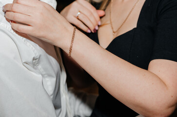gold bracelet on a woman's hand