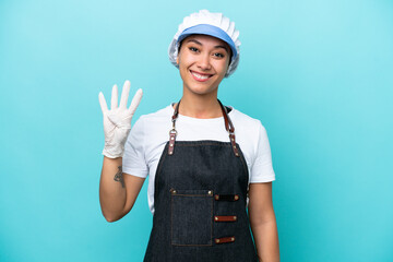 Fishwife Argentinian woman isolated on blue background happy and counting four with fingers