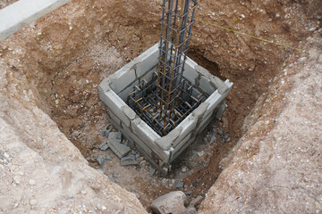reinforcement steel for the construction foundation or footing in concrete formwork for the next stage of work. © Montree