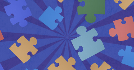 Image of colorful puzzles floating over rotating blue background