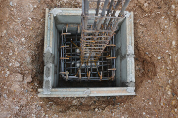 steel reinforced concrete columns and footing in block concrete framework.