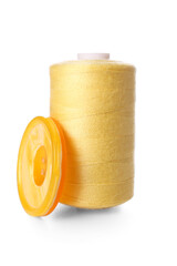 Yellow thread spool and button on white background