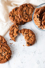 Oatmeal cookies with chocolate chips on a light background. Breakfast concept.