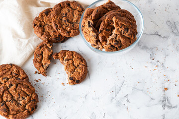 Oatmeal cookies with chocolate chips on a light background. Breakfast concept.