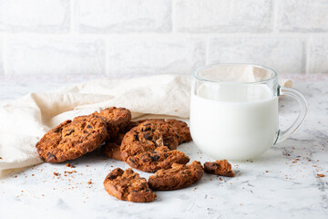 Oatmeal cookies with chocolate chips on a light background. Breakfast concept.