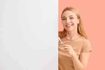 Beautiful mature woman with tooth brush and poster on color background