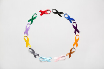 Circle frame made of awareness ribbons on light background. World Cancer Day