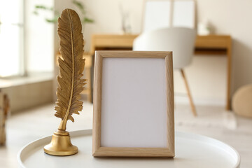 Blank frame with decor on table in room, closeup