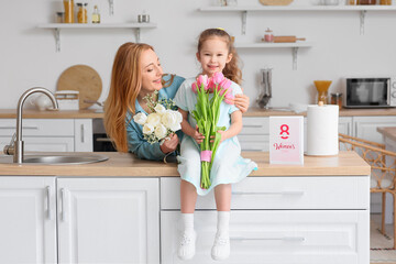 Fototapeta na wymiar Mature woman and her little granddaughter with flowers on International Women's Day at home