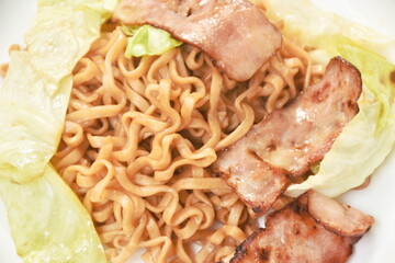 fried yakisoba Japanese noodles slice pork bacon and cabbage on plate