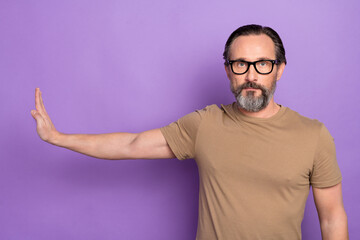 Photo of handsome serious man show stop sign against alcohol and unhealthy lifestyle isolated on...