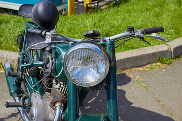 old motorcycle,Close up shot of a vintage motorcycle headlight and horn.