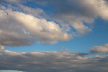 blue clear sky with lots of white fluffy clouds