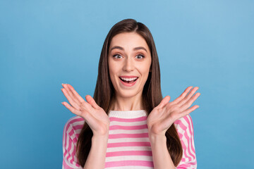 Fototapeta premium Photo of pretty impressed person raise arms stare camera cant believe isolated on blue color background