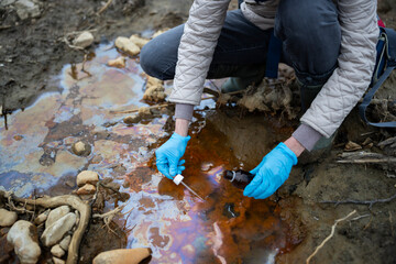 Ecologist Taking Samples of Polluted Water